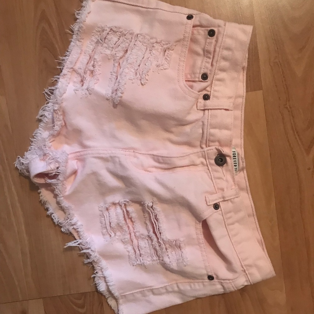 Pink distressed shorts